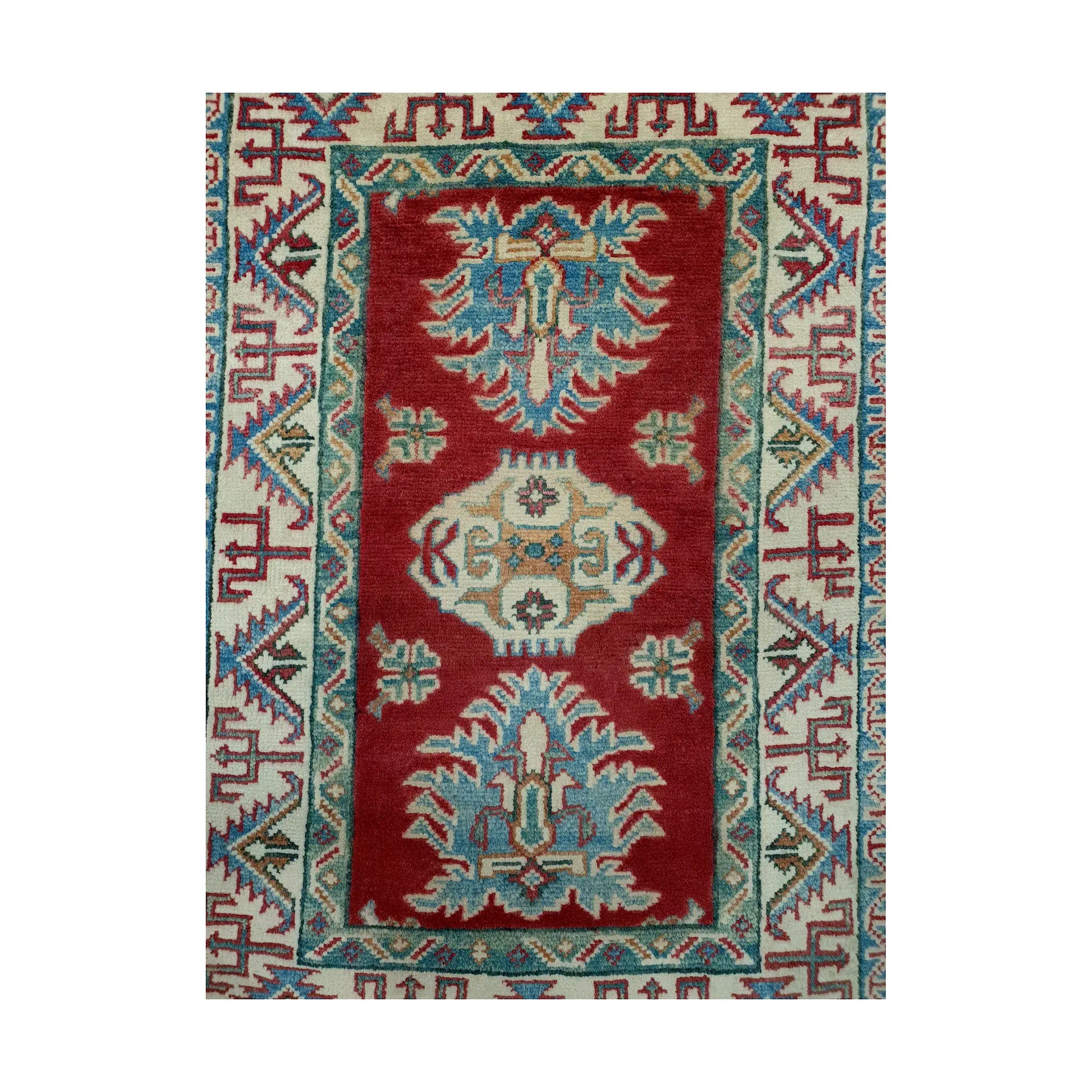 Front design view of Afghan Kazak hand-knotted wool rug showing red field, teal-blue motifs, ivory central detail and cream border