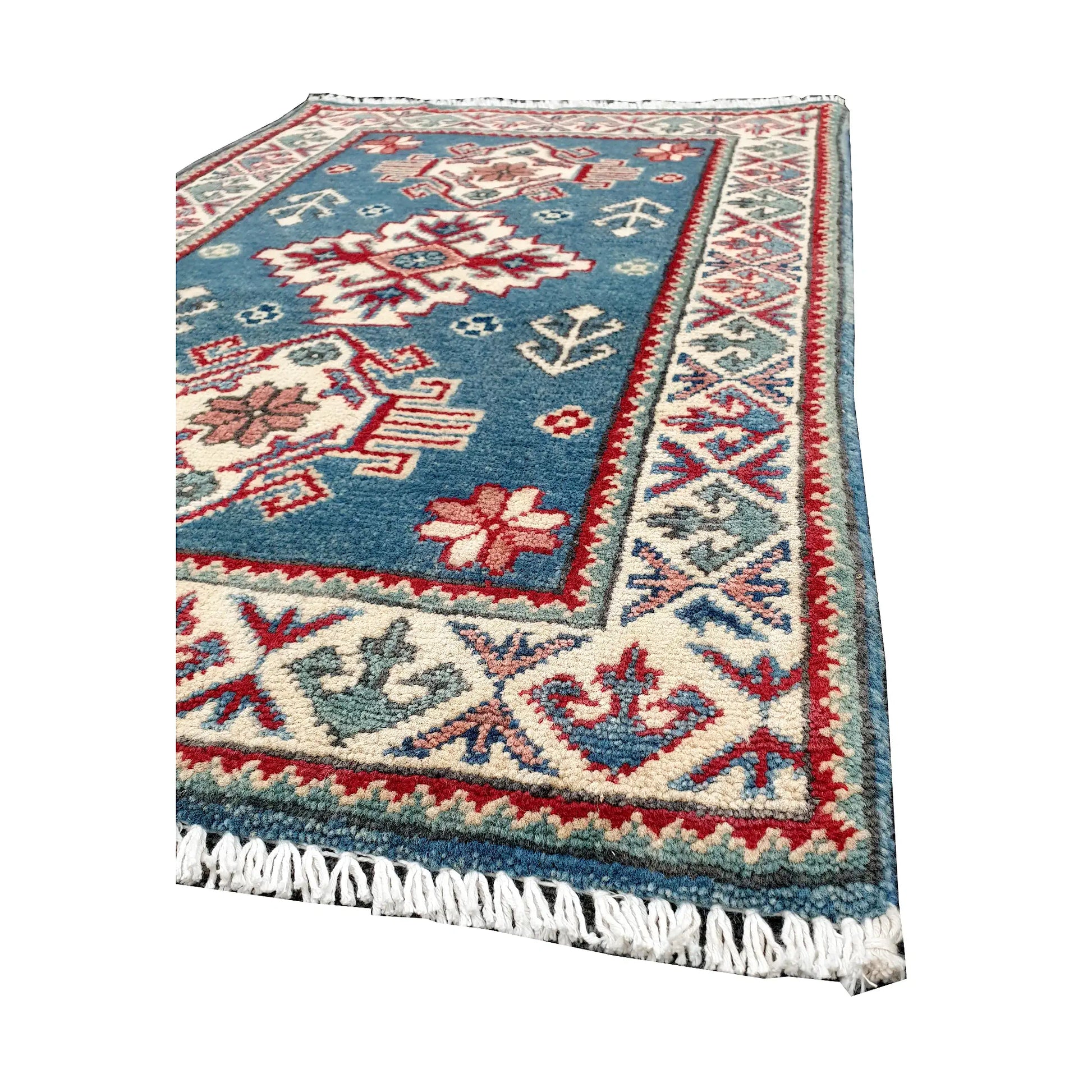 Angled corner and fringe view of Afghan Kazak wool rug showing blue field, cream border, red accents and light fringe