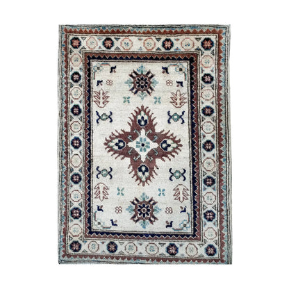 Front design view of Afghan Kazak hand-knotted wool rug showing central medallion, small geometric motifs and detailed border