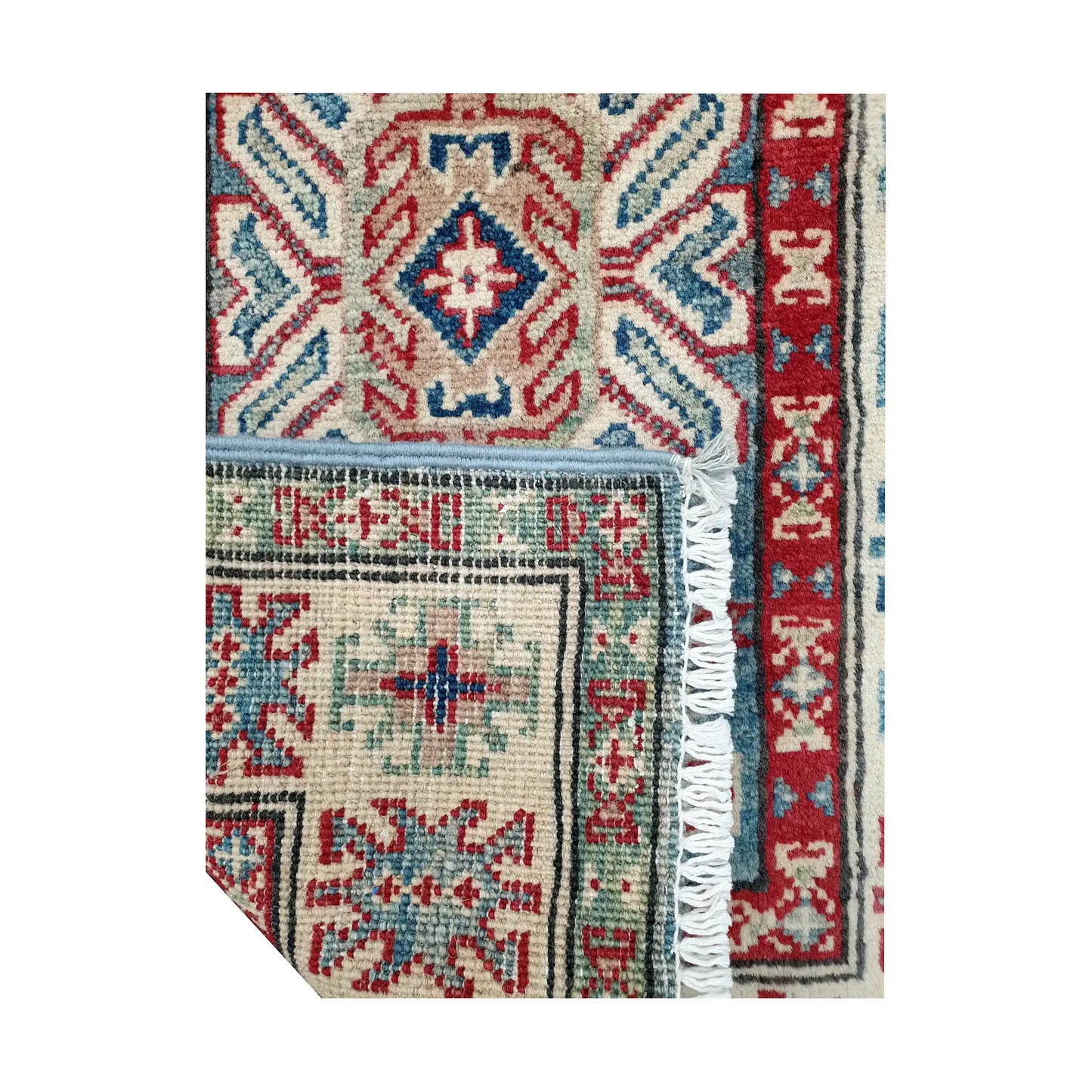 Folded corner reverse-weave detail of Afghan Kazak hand-knotted wool rug showing back structure, border pattern, fringe and weave