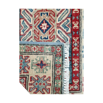Folded corner reverse-weave detail of Afghan Kazak hand-knotted wool rug showing back structure, border pattern, fringe and weave