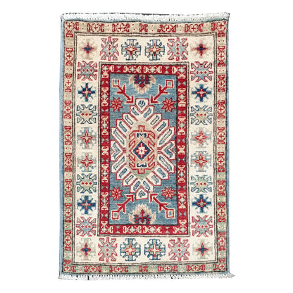 Full view of Afghan Kazak hand-knotted wool rug with blue field, off-white border and central geometric motif, 91 x 60 cm