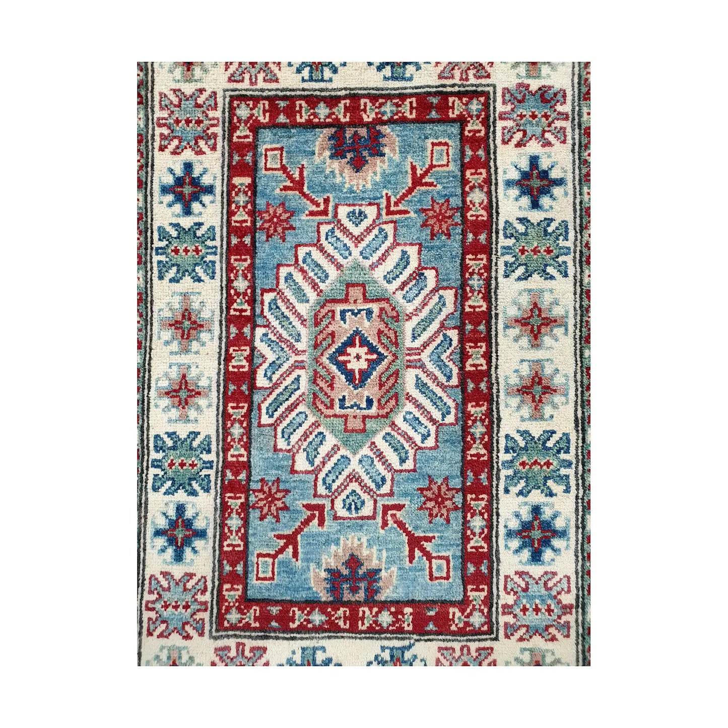 Front design view of Afghan Kazak hand-knotted wool rug showing central geometric motif, blue field and framed border