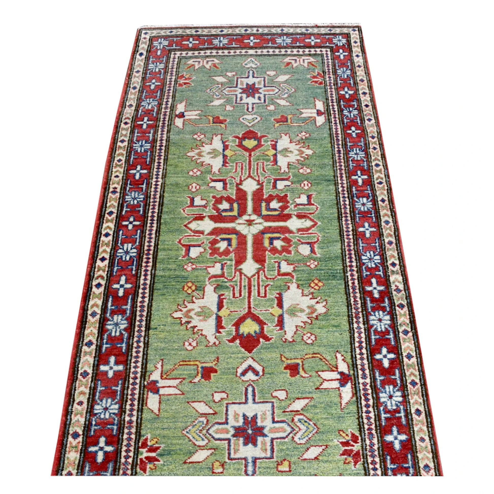 Lengthwise view of Afghan Kazak runner showing alternating red medallions and smaller cross motifs