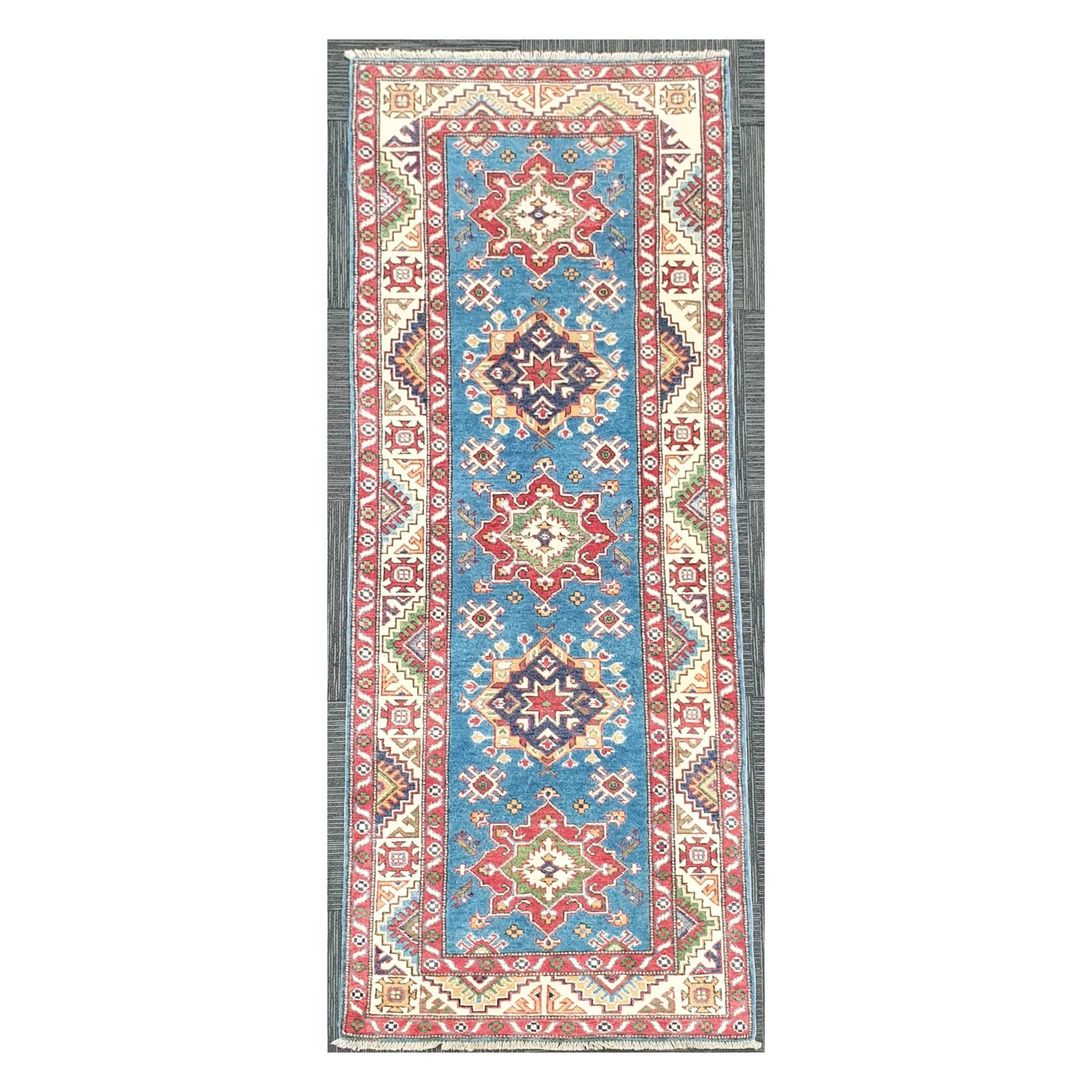 Full view of Afghan Kazak hand-knotted wool runner rug with sky blue field and geometric medallions, 250 x 88 cm