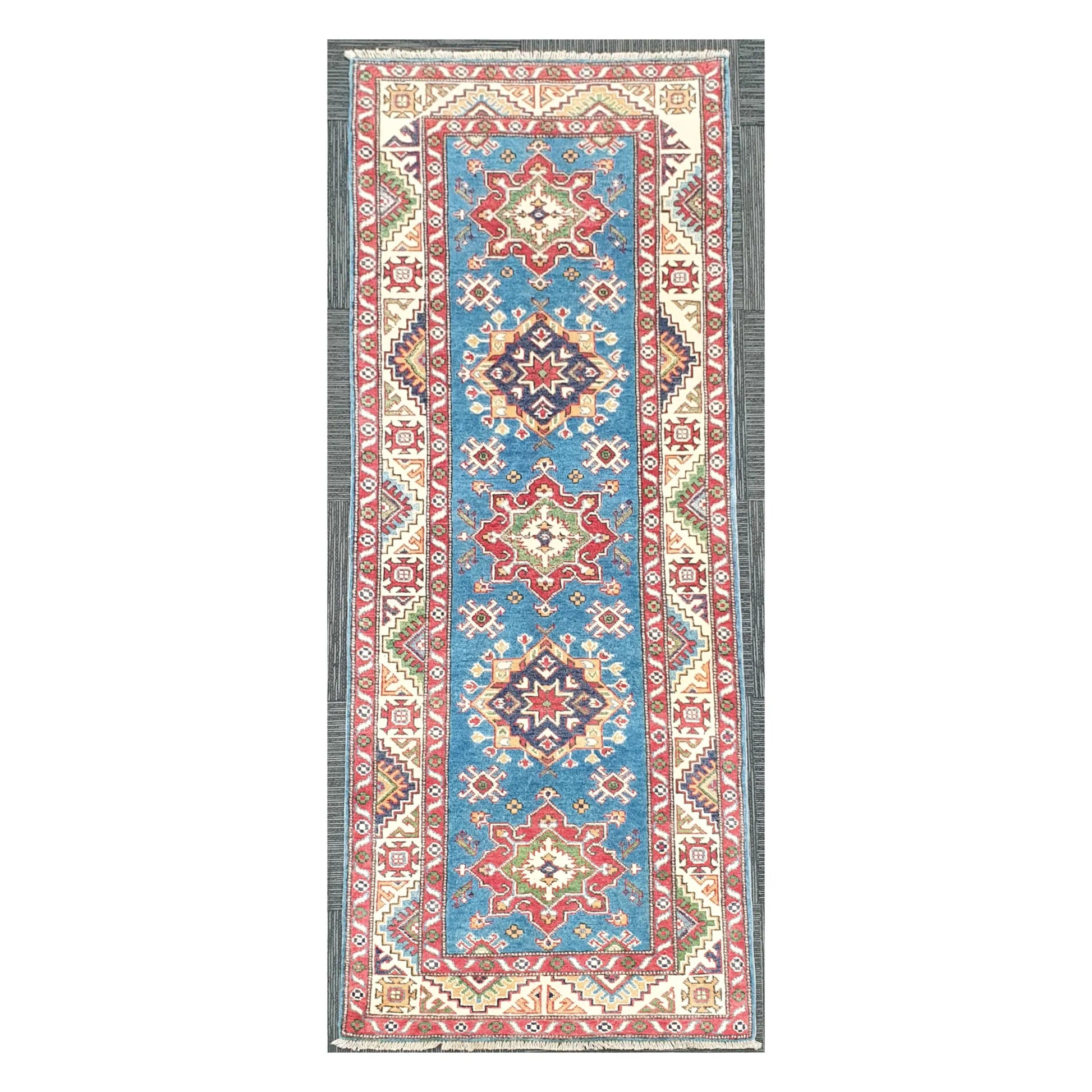 Full view of Afghan Kazak hand-knotted wool runner rug with sky blue field and geometric medallions, 250 x 88 cm