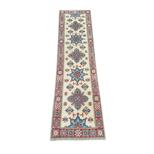 Angled full view of Afghan Kazak wool runner rug with colourful geometric medallions