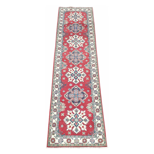 Afghan Kazak hand-knotted wool runner rug 300 x 81 cm shown in full view with red geometric medallion design