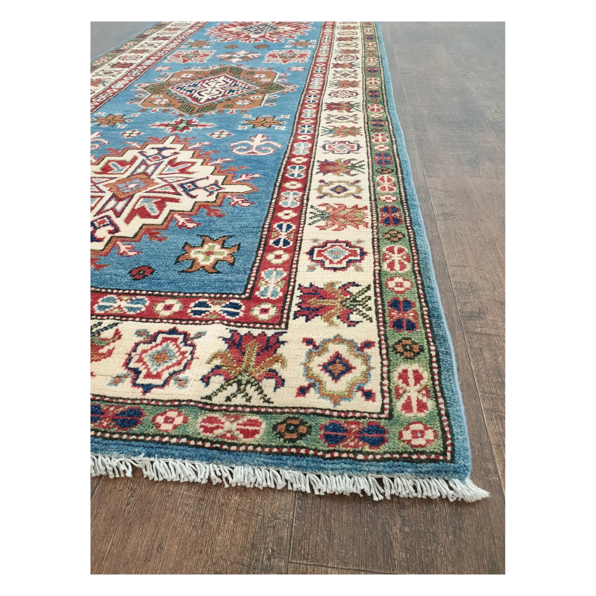 Angled detail of Kazak runner showing border motifs, fringe, and hand-knotted wool texture, 358 x 97 cm
