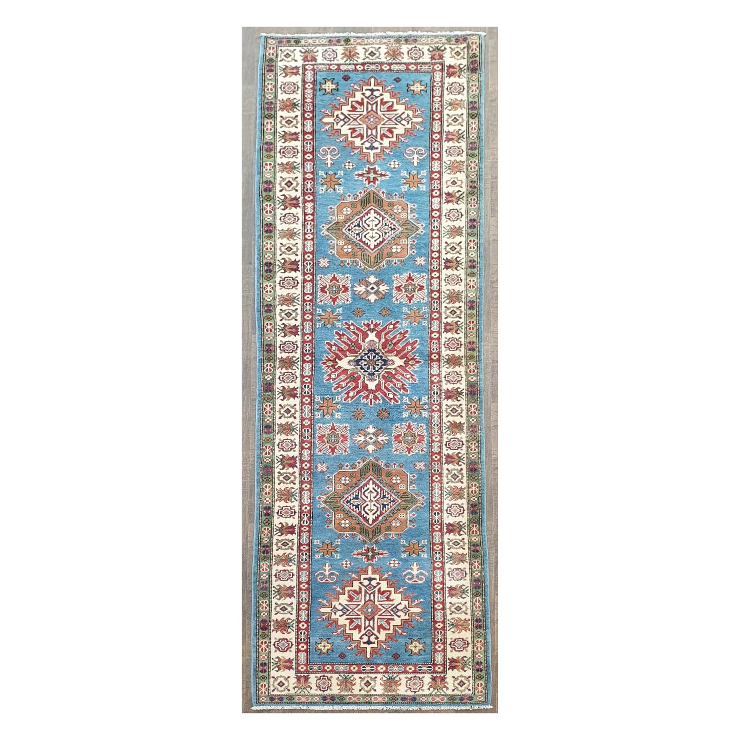 Full view of Afghan Kazak hand-knotted wool runner rug with sky blue field and geometric medallions, 358 x 97 cm