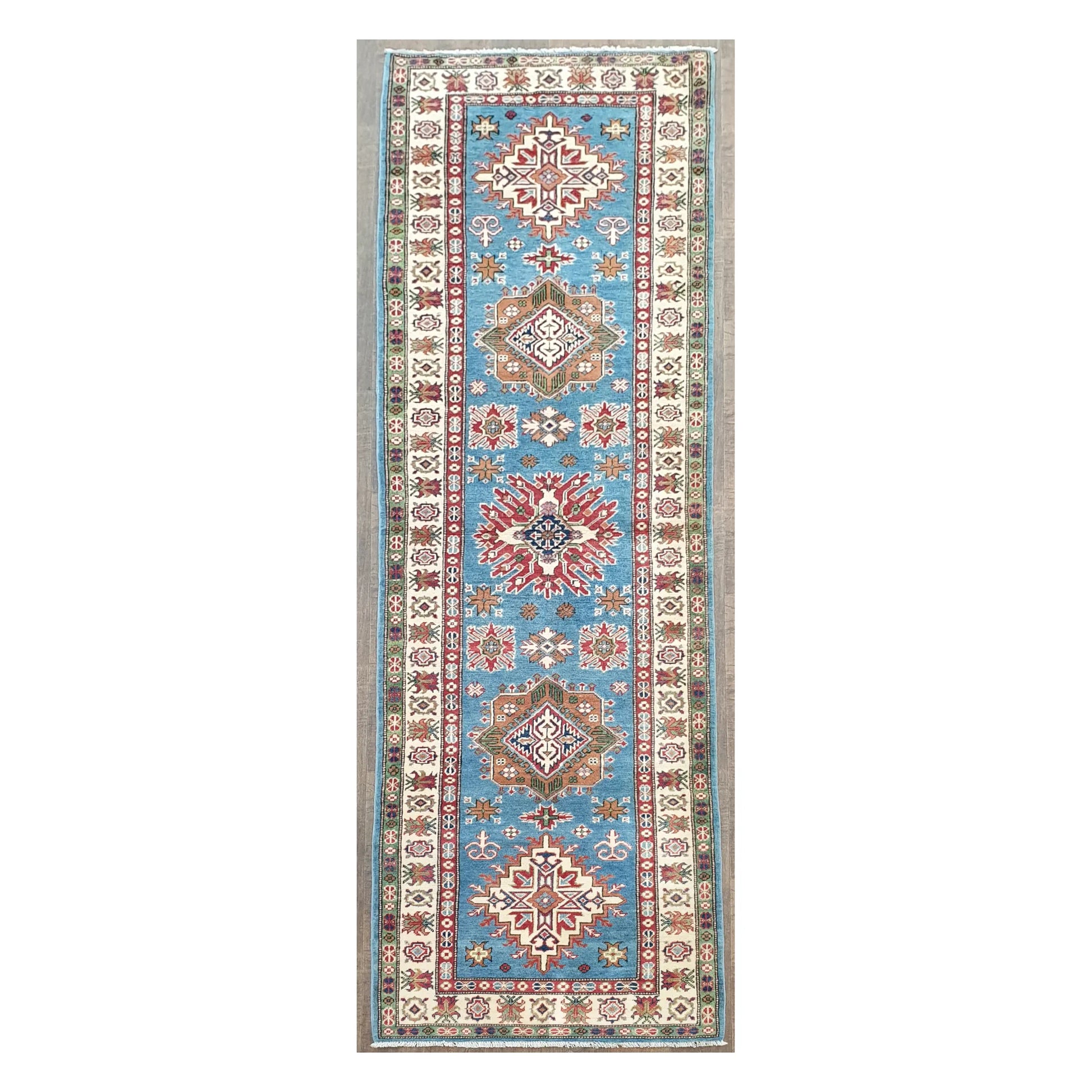 Full view of Afghan Kazak hand-knotted wool runner rug with sky blue field and geometric medallions, 358 x 97 cm