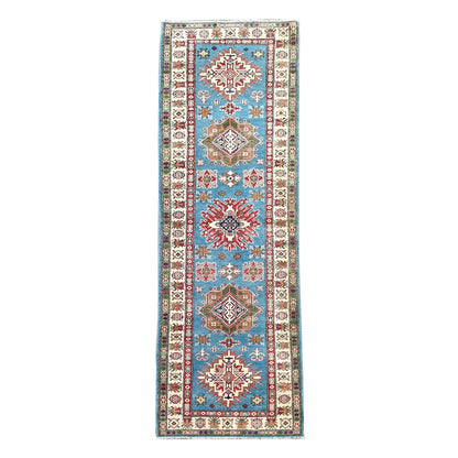 Full view of Afghan Kazak hand-knotted wool runner rug with sky blue field and geometric medallions, 358 x 97 cm