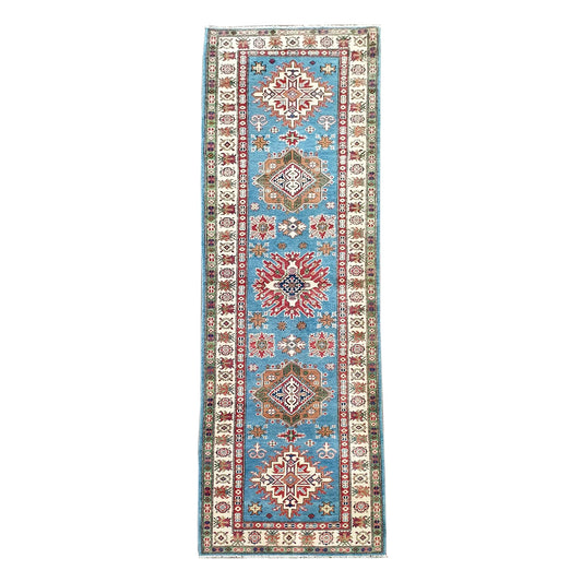 Full view of Afghan Kazak hand-knotted wool runner rug with sky blue field and geometric medallions, 358 x 97 cm