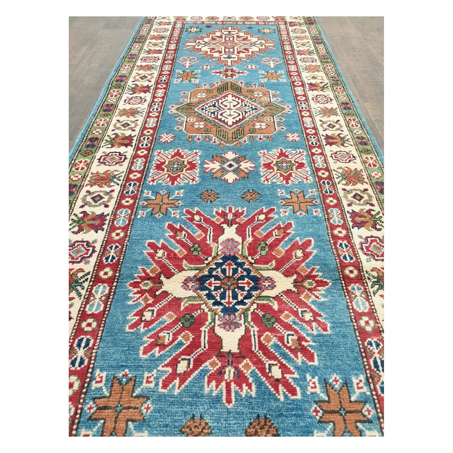 Detailed view of Afghan Kazak runner showing elongated geometric pattern and colourful border motifs, 358 x 97 cm