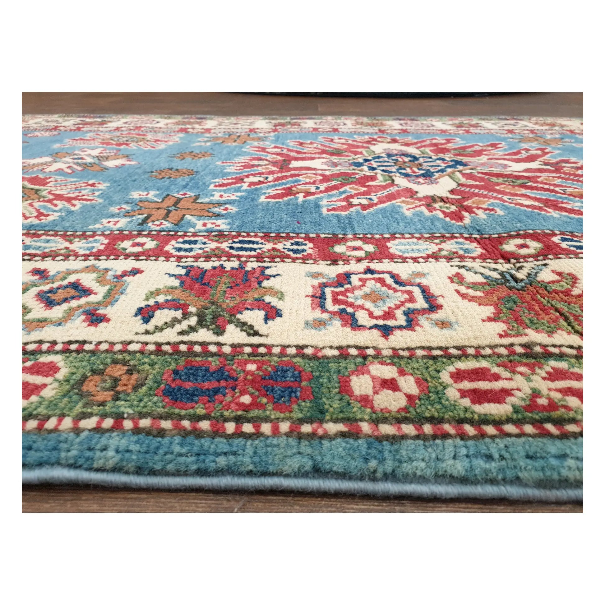 Low-angle close-up of Kazak runner showing wool pile texture and colourful tribal border detail, 358 x 97 cm