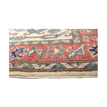 Border-edge detail of Afghan Kazak wool runner rug with red and blue accents, 291 x 83 cm