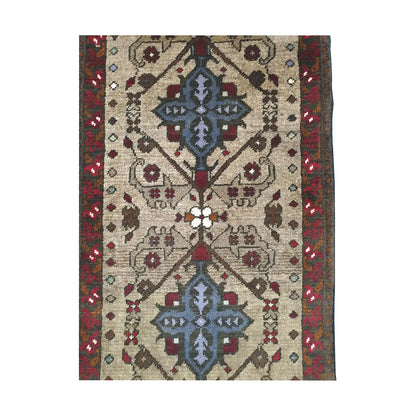 Double medallion field detail of Afghan Khal Mohammadi hand-knotted rug showing blue-grey motifs, ivory ground and red border