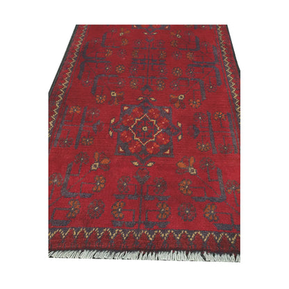 Central medallion and field detail of Afghan Khal Mohammadi hand-knotted rug showing red ground, dark tribal motifs and patterned border