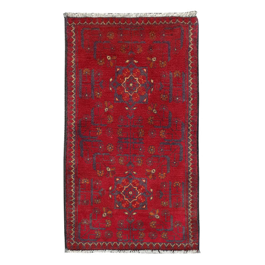 Full view of Afghan Khal Mohammadi hand-knotted wool rug with deep red field, central geometric medallion and patterned border, 102 x 52 cm