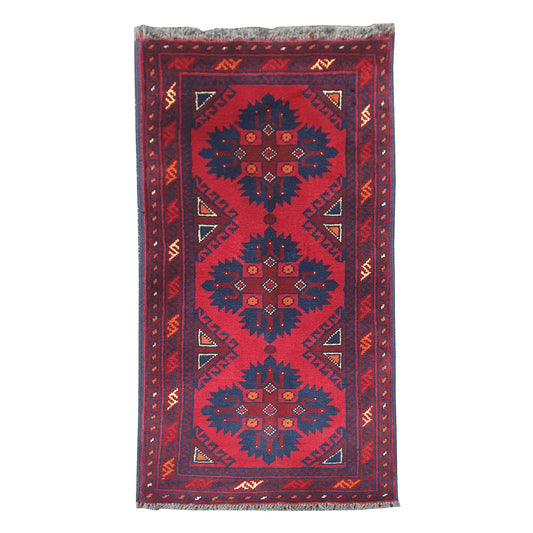 Full view of Afghan Khal Mohammadi hand-knotted wool rug with deep red field, dark blue geometric medallions and patterned border, 106 x 52 cm