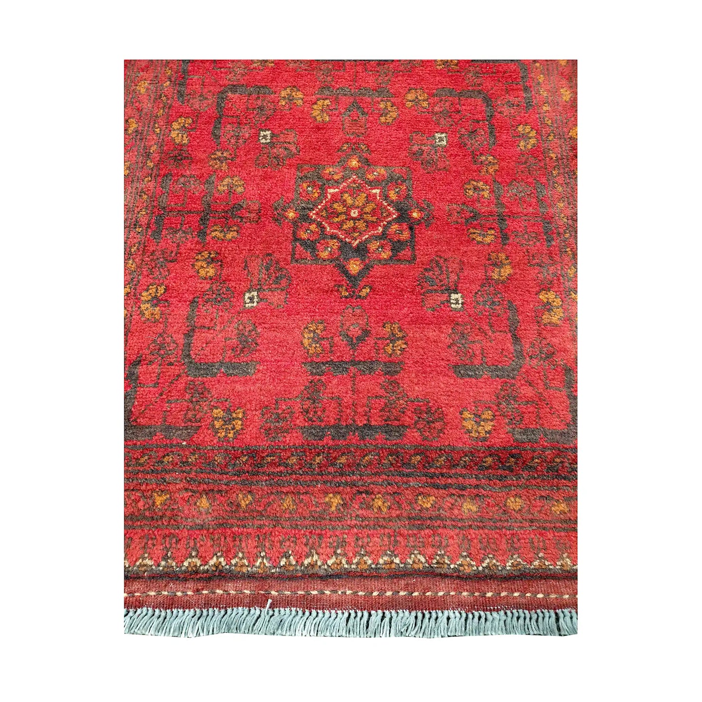 Central medallion and field detail of Afghan Khal Mohammadi hand-knotted rug showing red ground, small tribal motifs and patterned border