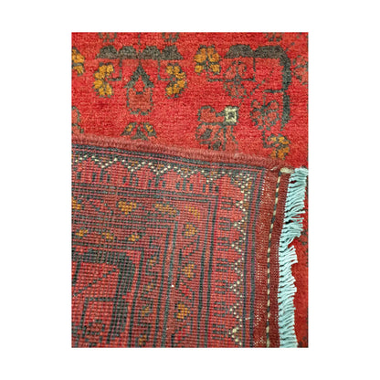 Folded corner reverse-weave detail of Afghan Khal Mohammadi hand-knotted wool rug showing back structure, fringe, border pattern and weave
