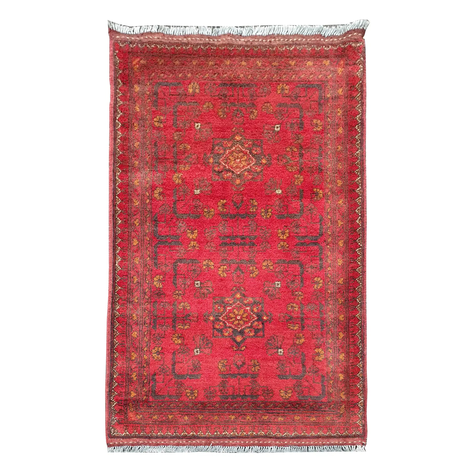 Full view of Afghan Khal Mohammadi hand-knotted wool rug with warm red field, central geometric medallion and patterned border, 106 x 56 cm