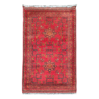 Full view of Afghan Khal Mohammadi hand-knotted wool rug with warm red field, central geometric medallion and patterned border, 106 x 56 cm