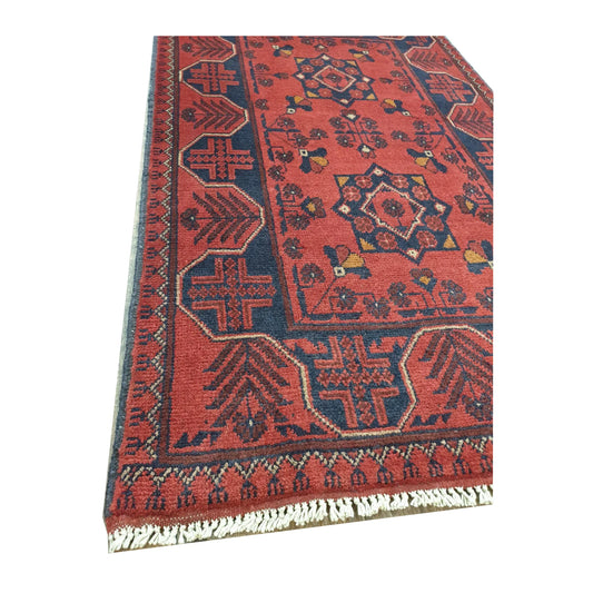 Close-up of Afghan Khal Mohammadi wool rug showing red border detail, fringe edge and hand-knotted pile texture, 127 x 78 cm