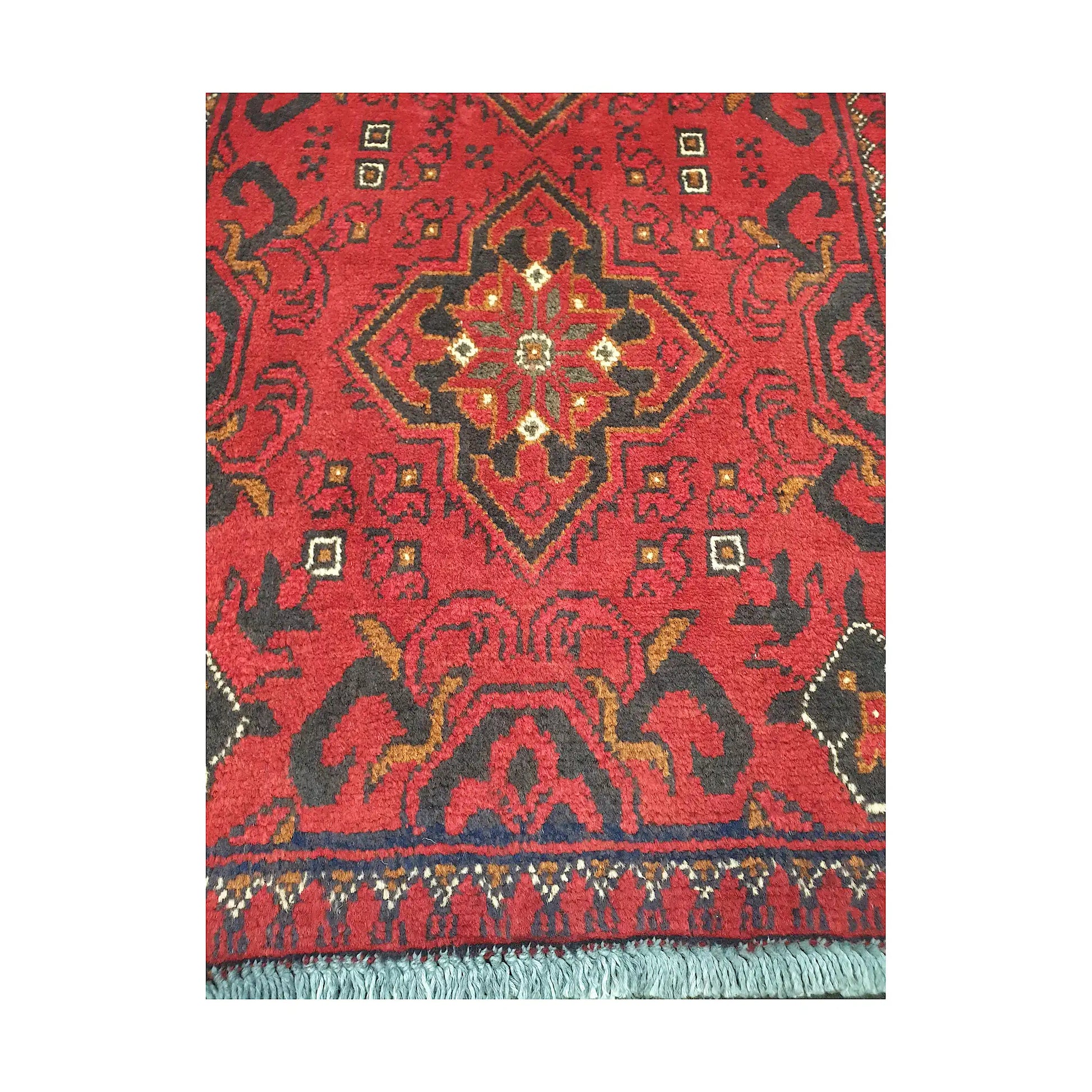 Central medallion and field detail of Afghan Khal Mohammadi hand-knotted rug showing red ground, dark motifs and geometric border
