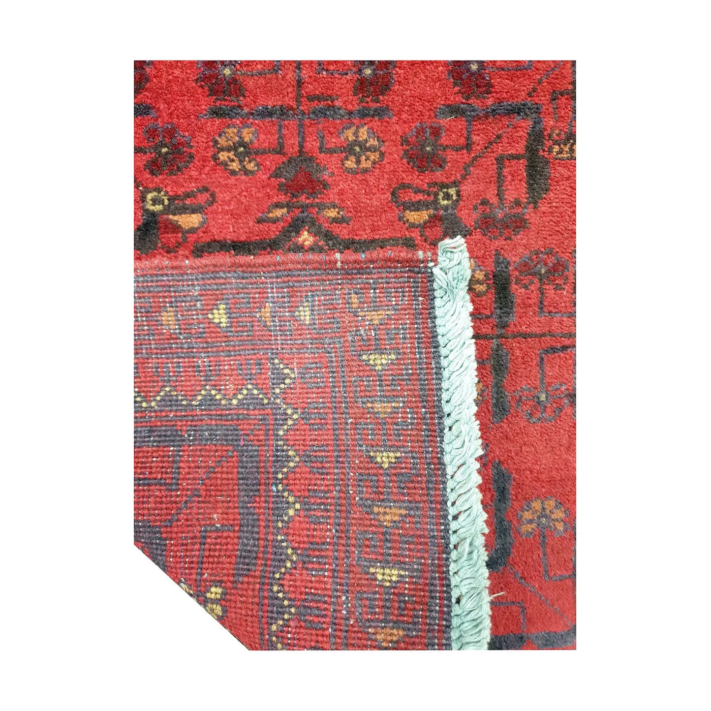 Folded corner reverse-weave detail of Afghan Khal Mohammadi hand-knotted wool rug showing back structure, red field, border pattern and weave