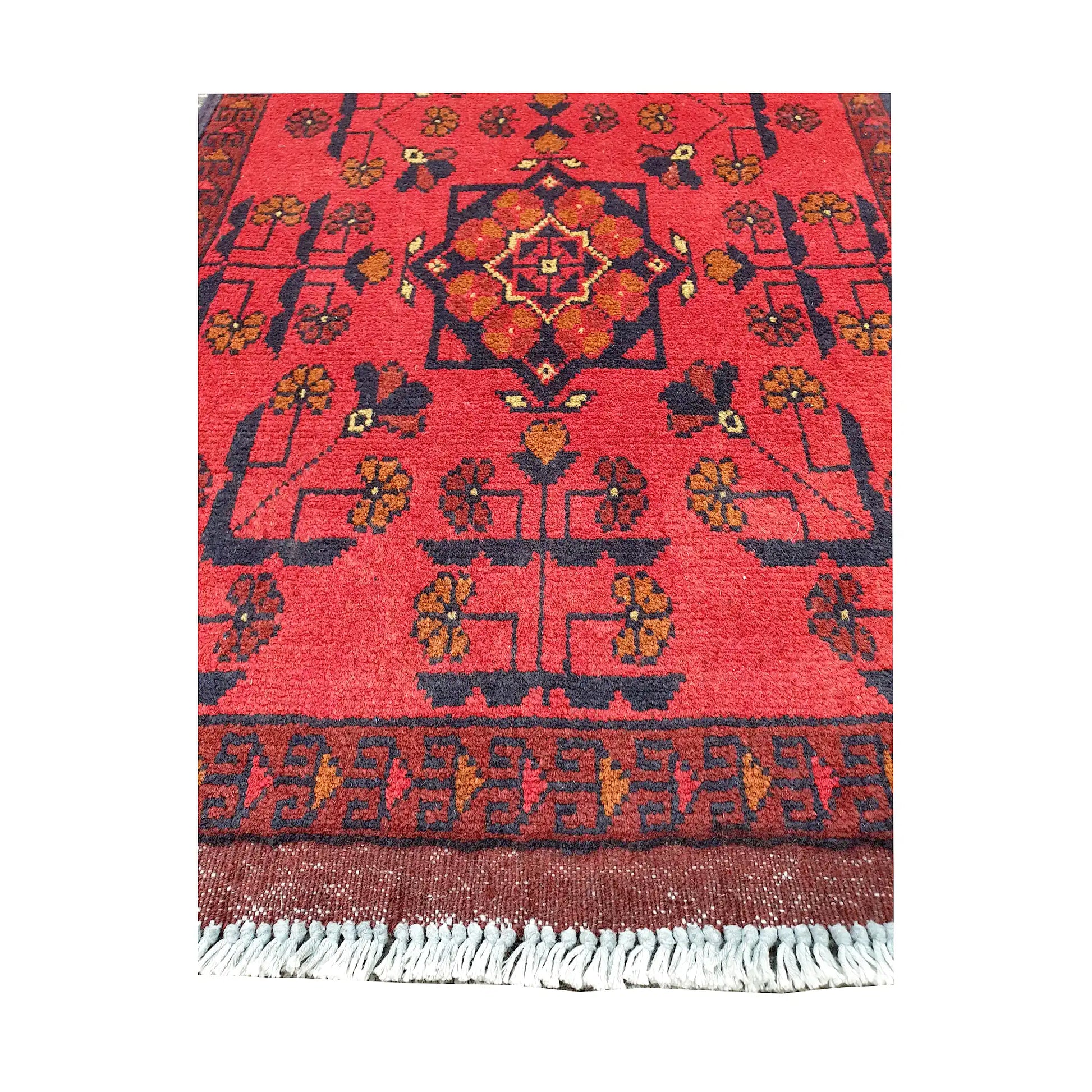 Central medallion and field detail of Afghan Khal Mohammadi hand-knotted rug showing red ground, dark motifs and patterned border