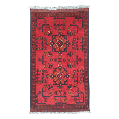 Full view of Afghan Khal Mohammadi hand-knotted wool rug with deep red field, central geometric medallion and patterned border, 98 x 50 cm