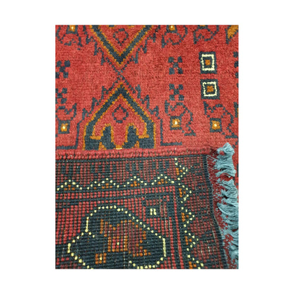 Folded corner reverse-weave detail of Afghan Khal Mohammadi hand-knotted wool rug showing back structure, border pattern, fringe and weave