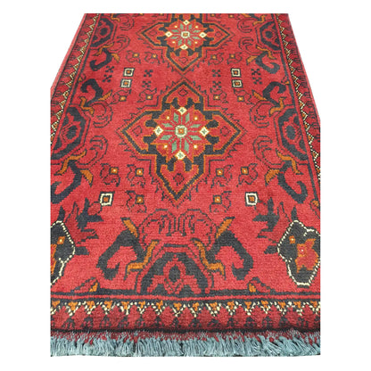 Medallion and field detail of Afghan Khal Mohammadi hand-knotted rug showing deep red ground, dark motifs and warm accent colours