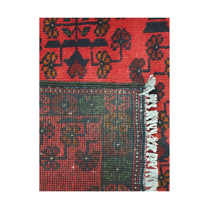Folded corner reverse-weave detail of Afghan Khal Mohammadi hand-knotted wool rug showing back structure, border pattern, fringe and weave