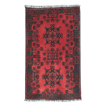Full view of Afghan Khal Mohammadi hand-knotted wool rug with deep red field, central geometric medallion and patterned border, 99 x 52 cm