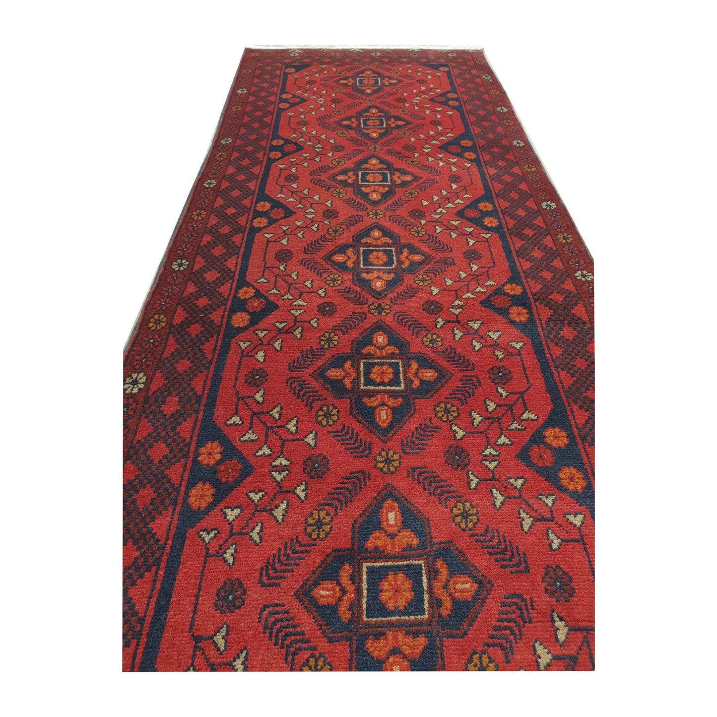 Angled full view of Afghan Khal Mohammadi wool runner rug showing red field, fringe and traditional geometric border