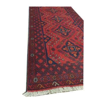 Border and fringe detail of Afghan Khal Mohammadi hand-knotted wool runner rug showing red and blue geometric pattern