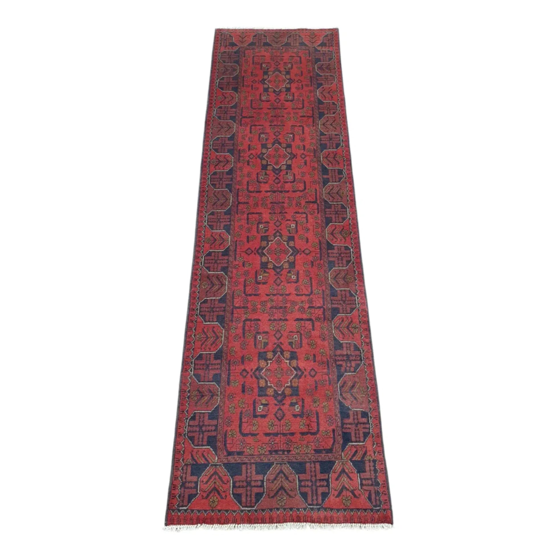 Full view of Afghan Khal Mohammadi hand-knotted wool runner rug with rich red field, repeating geometric medallions and deep navy border, 287 x 84 cm