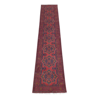 Full view of Afghan Khal Mohammadi hand-knotted wool runner rug with deep red field and repeating floral-geometric medallions, 385 x 80 cm