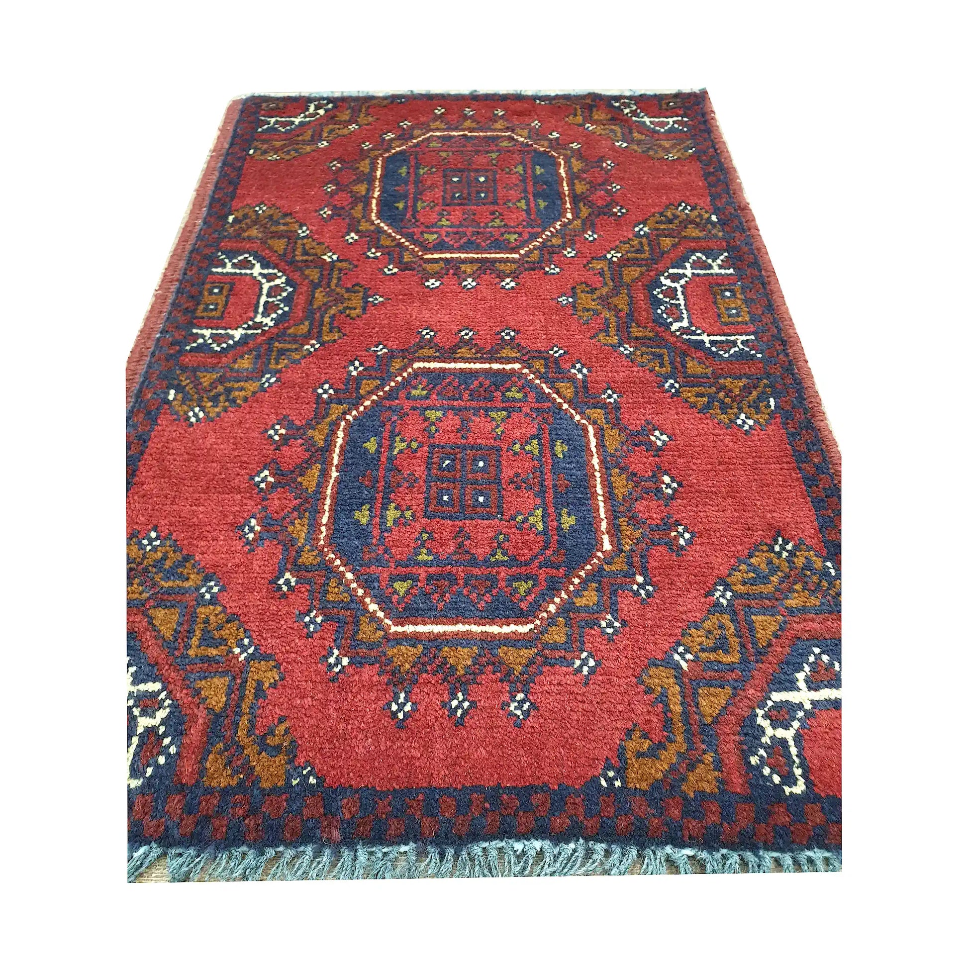 Afghan Khal Mohammadi wool rug detail showing paired octagonal medallion panels with ochre and ivory accents
