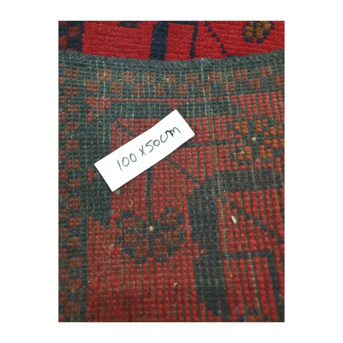Reverse weave detail of Afghan Khal Mohammadi rug showing the handmade structure and size label