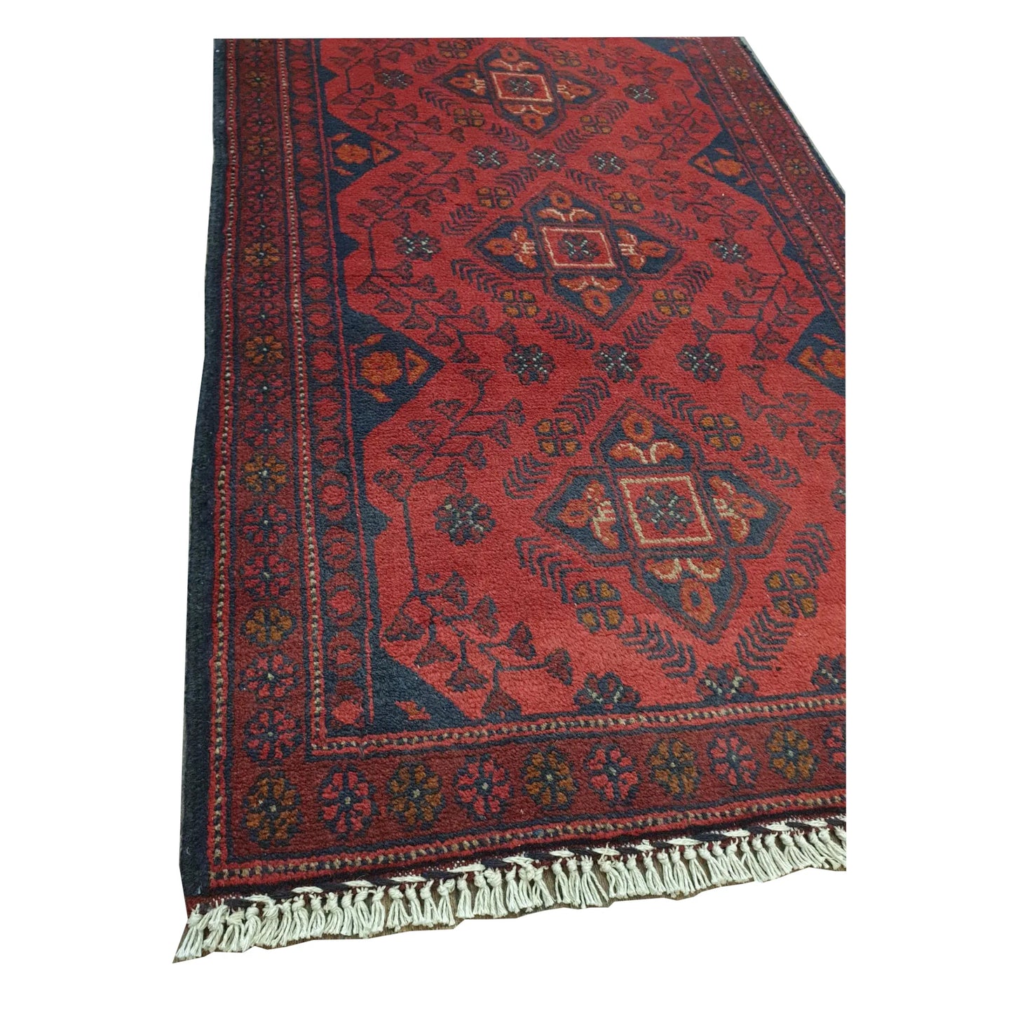 Close-up of Afghan Khal Mohammadi rug showing red geometric pattern and fringe detail