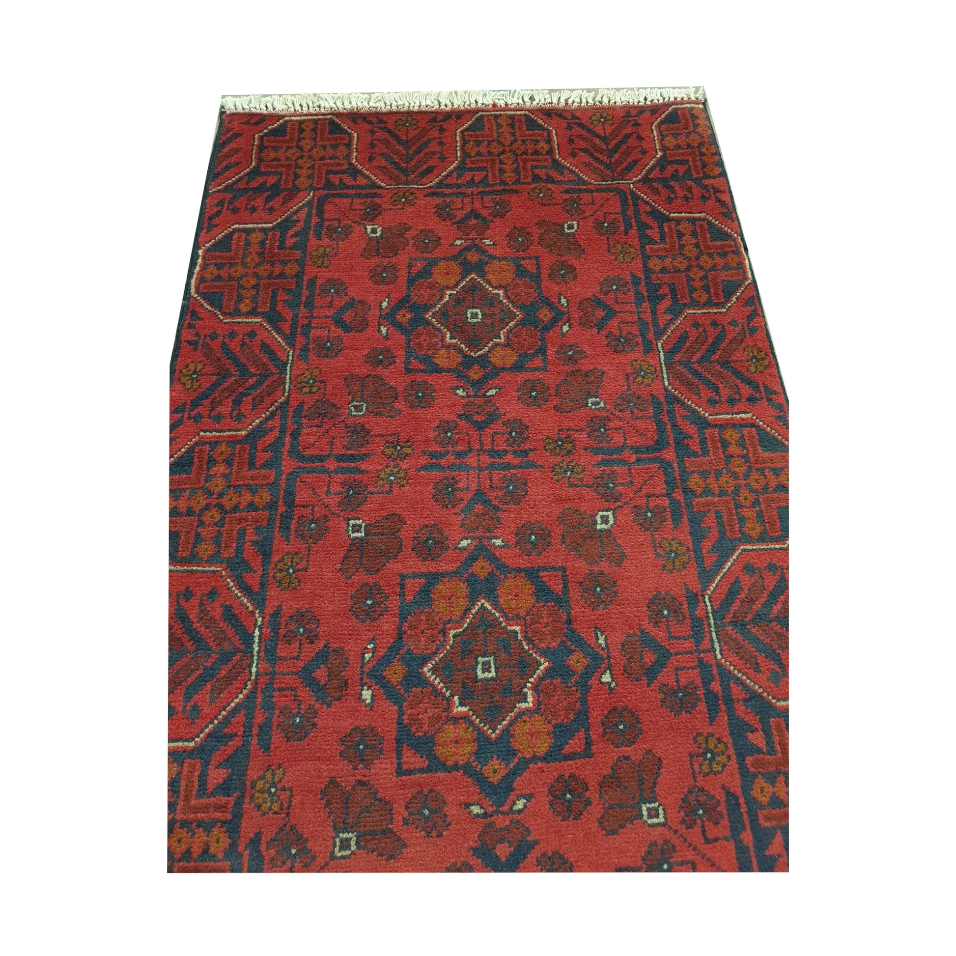 Close-up of Afghan Khal Mohammadi rug showing red geometric pattern and fringe detail