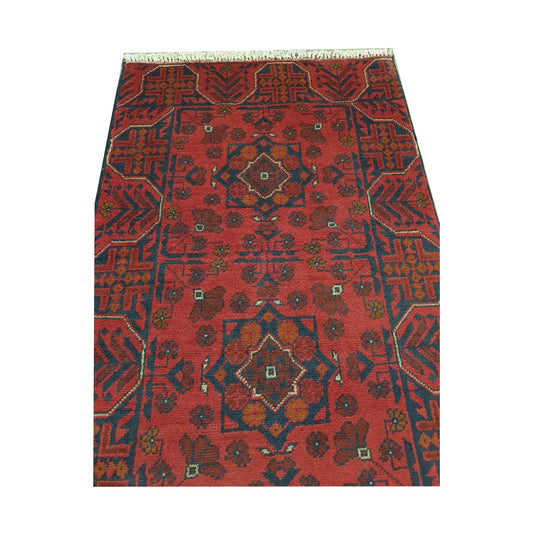 Close-up of Afghan Khal Mohammadi rug showing red geometric pattern and fringe detail