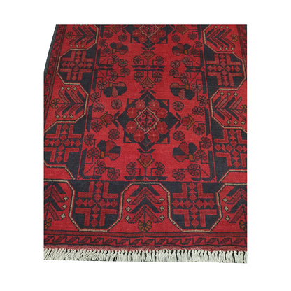 End field and fringe detail of Afghan Khal Mohammadi rug with tonal red and charcoal geometric motifs