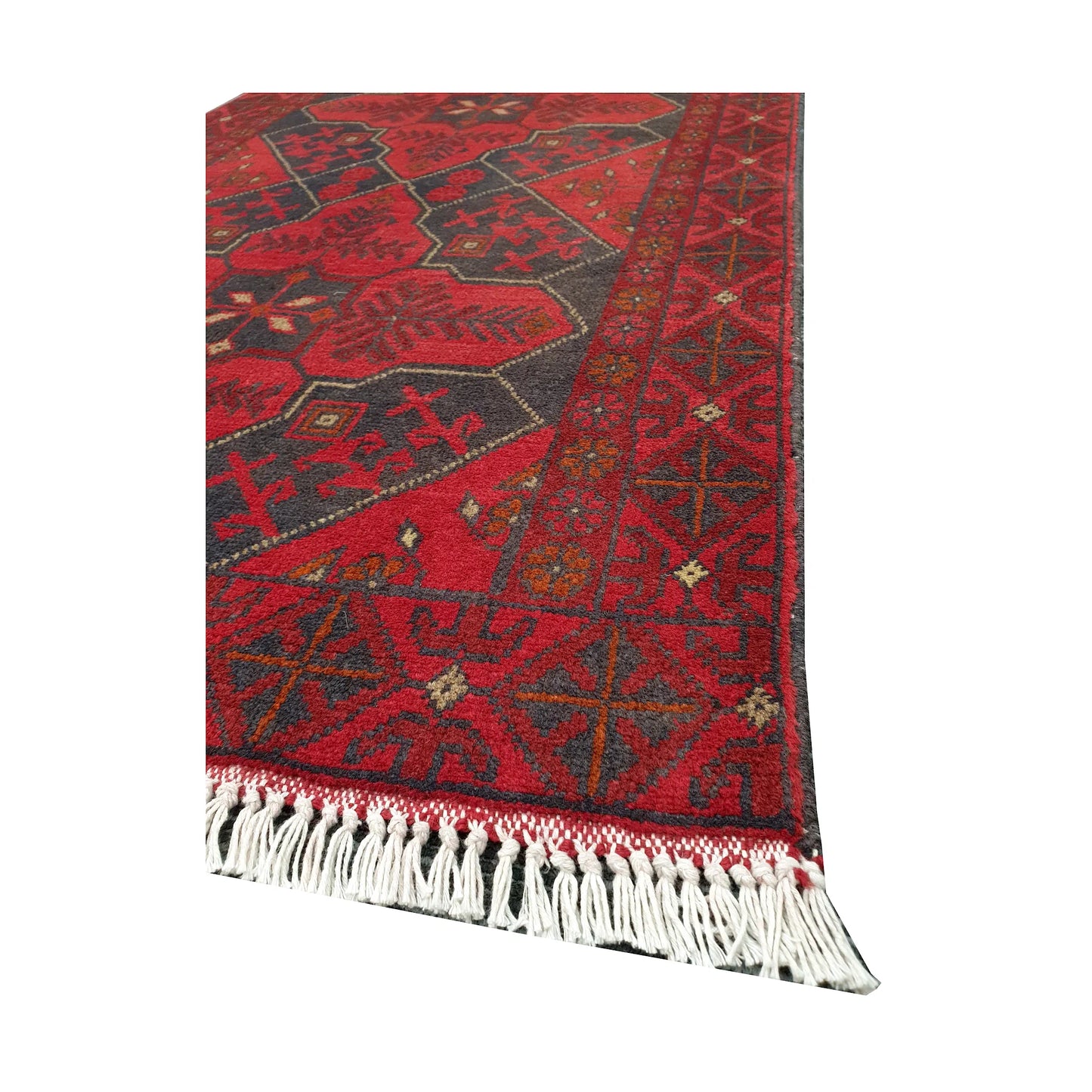 Angled fringe and edge detail of Afghan Khal Mohammadi rug showing deep red wool pile and dark geometric border
