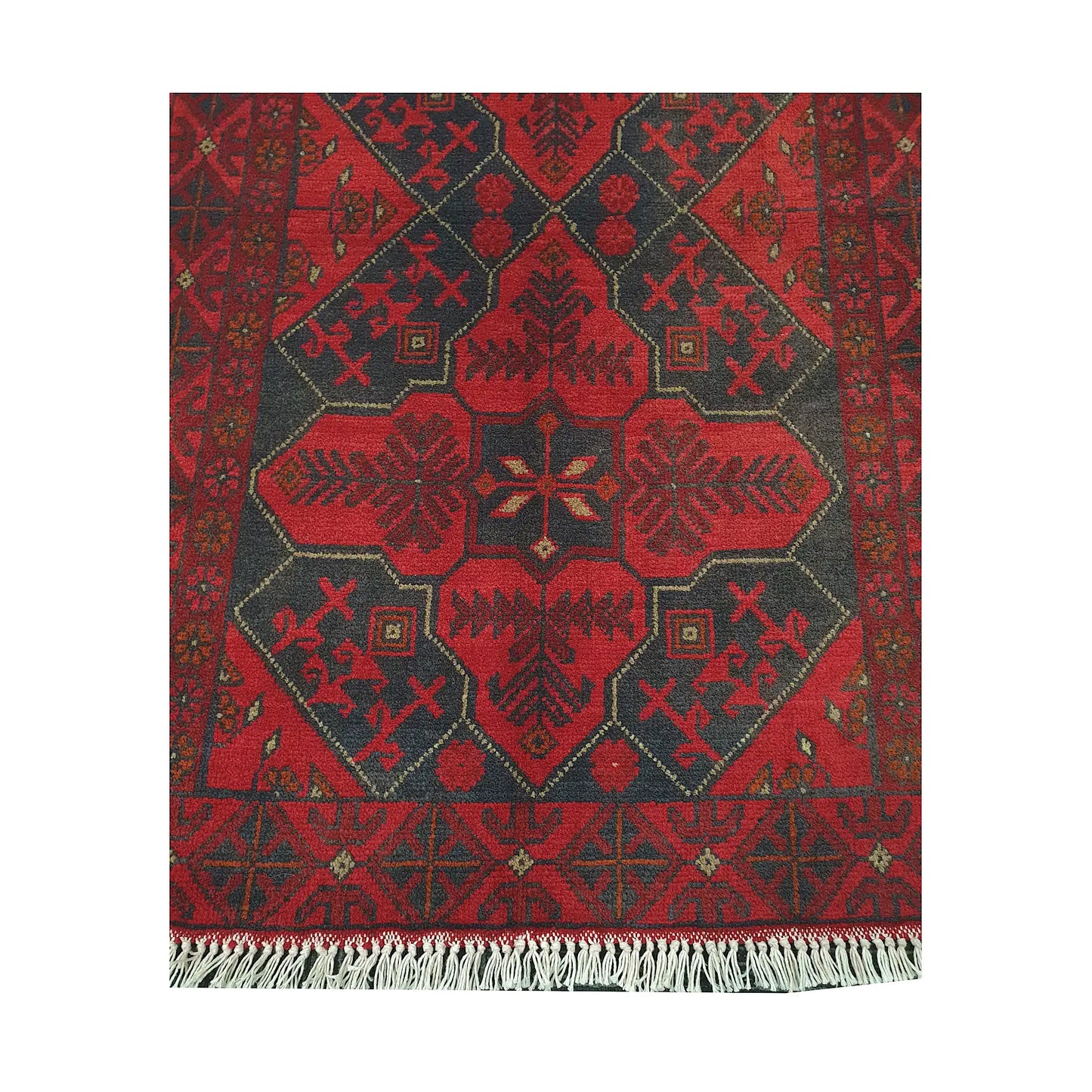 Central medallion and fringe detail of Afghan Khal Mohammadi rug with deep red field and charcoal tribal motifs
