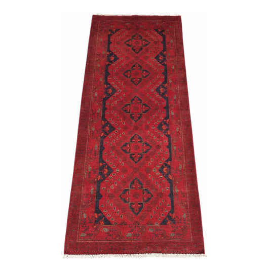 Full view of Afghan Khal Mohammadi hand-knotted wool runner rug with red field, dark blue medallions and patterned border, 202 x 82 cm